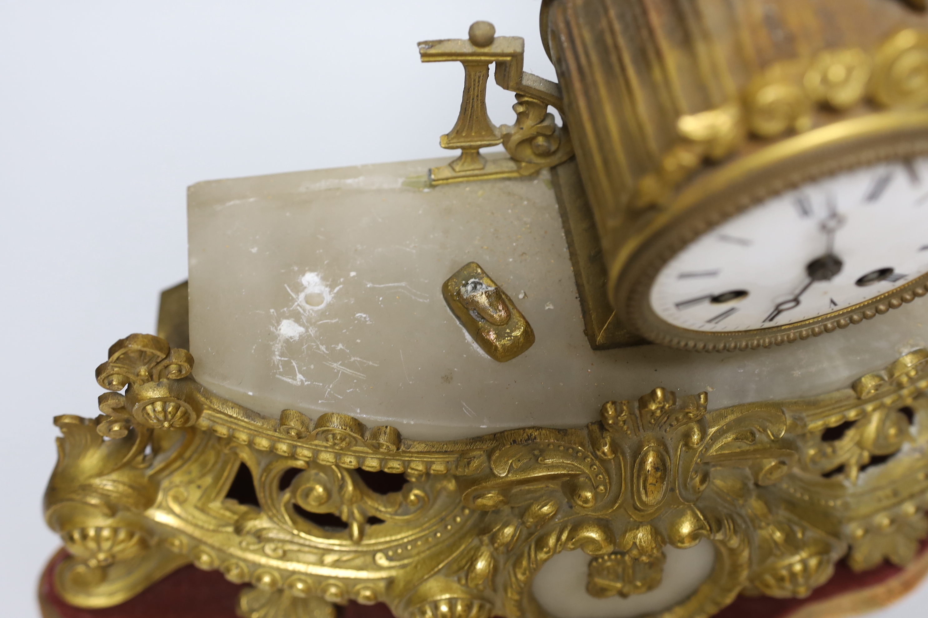 A French gilt-metal and onyx mantel clock, on shaped base, a.f., 52cm high